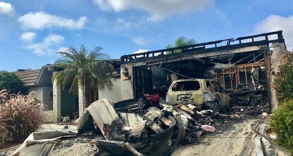House fire caused this garage to be burned along with the car inside. Insurance is necessary.